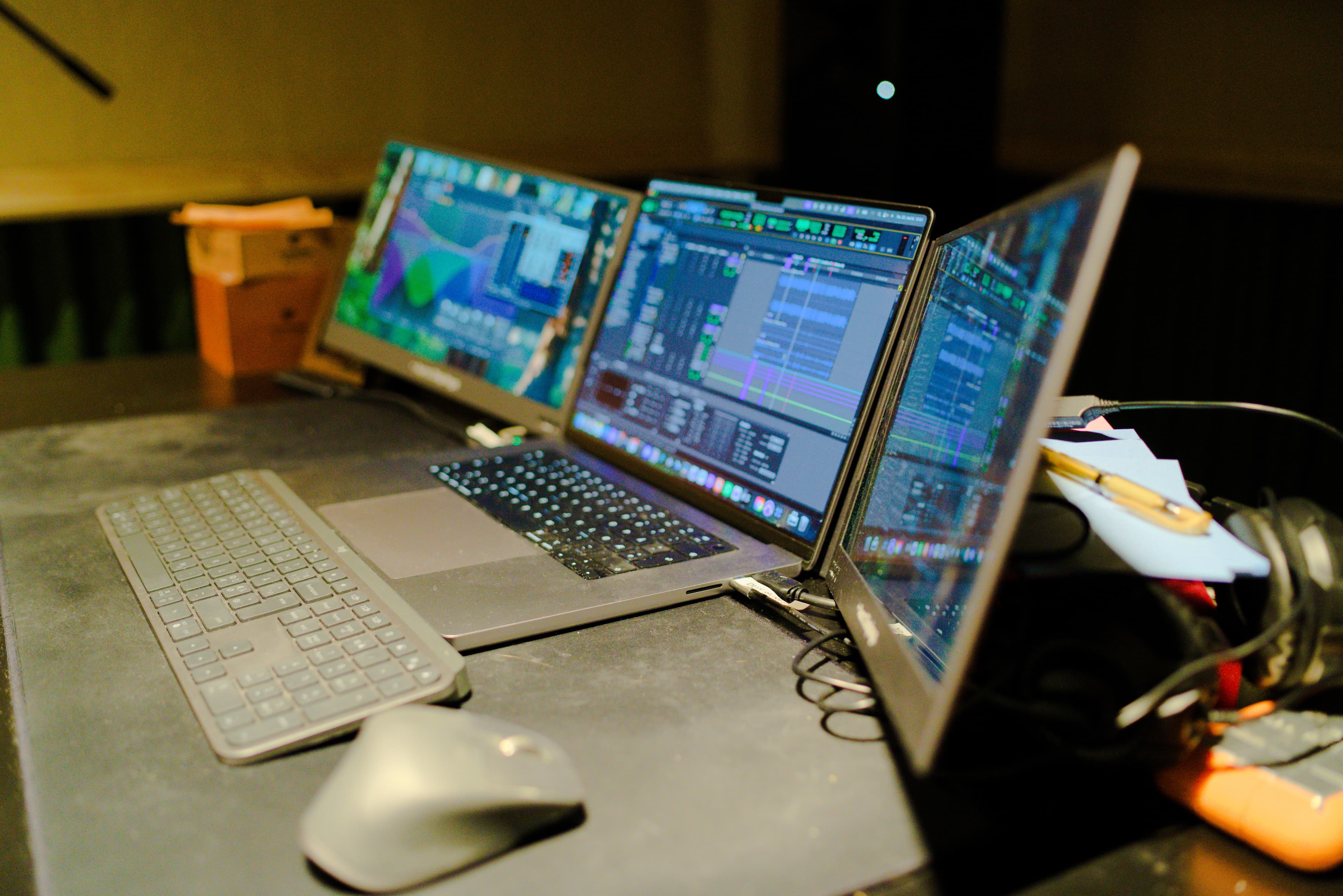 Production setup with multiple monitors running DAW software