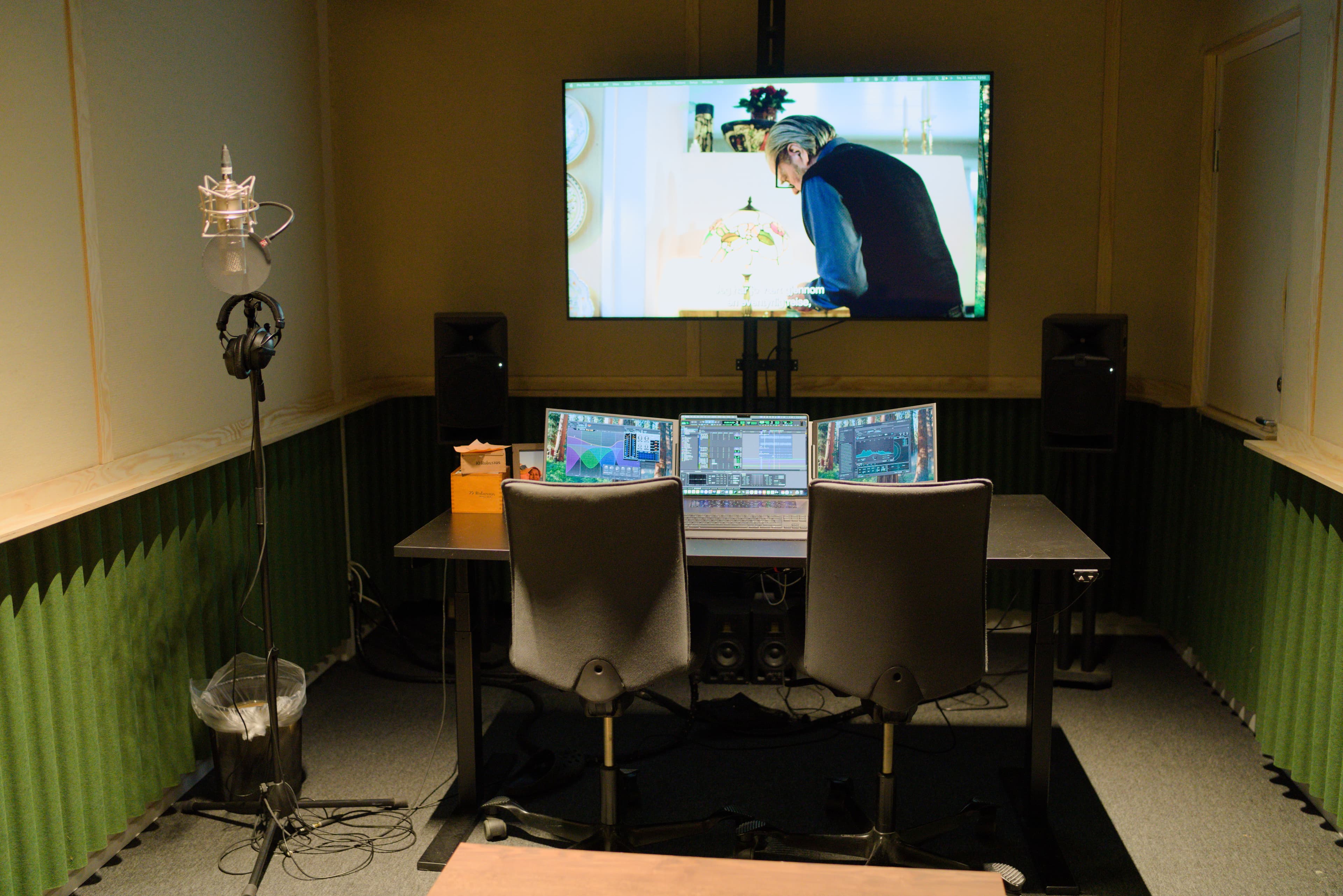 Courthouse mixing room with large screen and acoustic panels